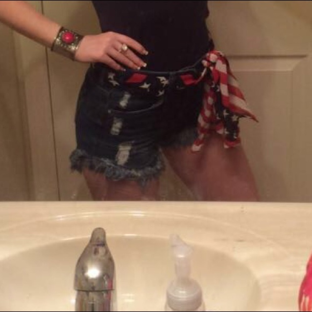 Destressed denim shorts
